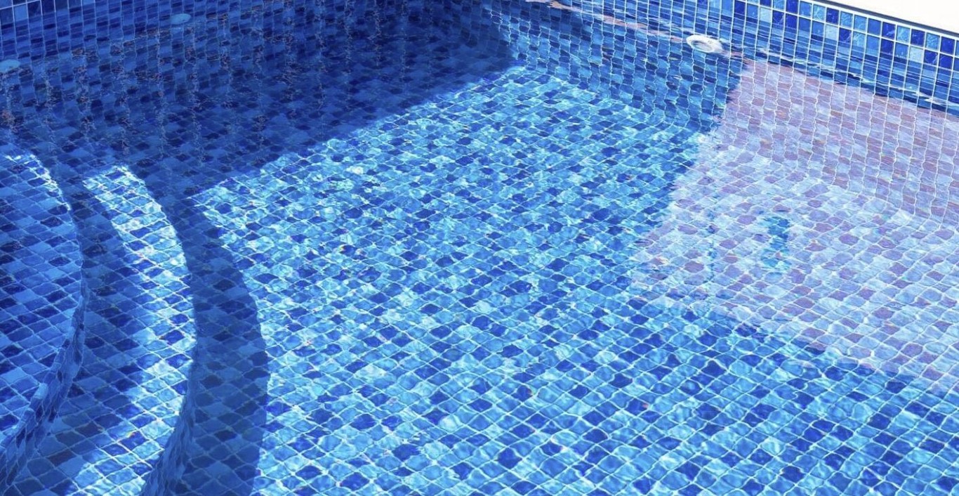 Clean pool tiles after professional calcium scale removal in Delano, CA